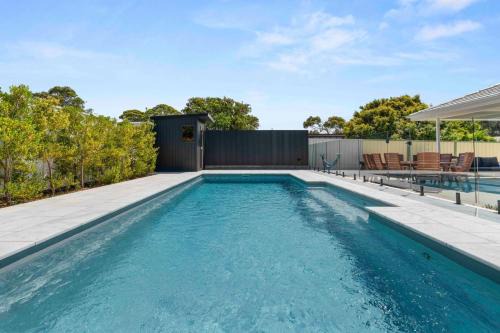 Culburra Beach House | Luxe 4BR Retreat with Heated Pool & Finnish Sauna, Steps to the Beach