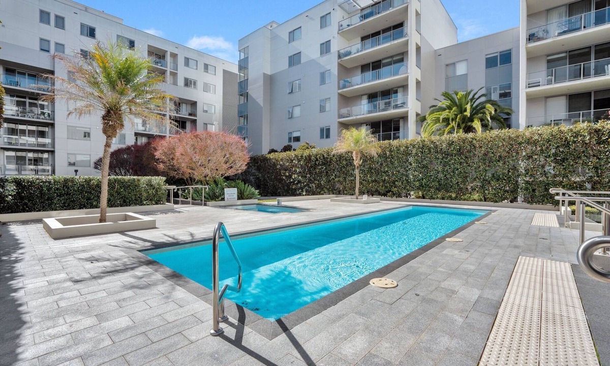 City East Apartment | Modern 1-Bed Unit with Pool Views and Balcony