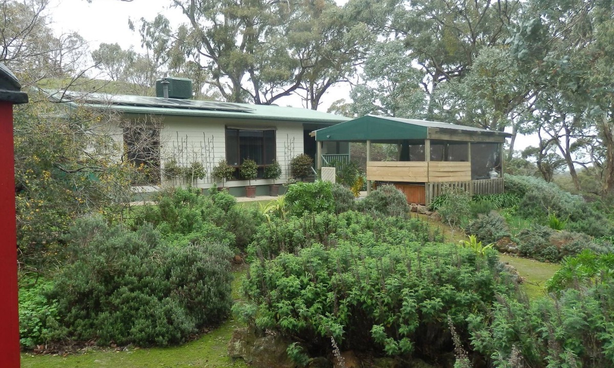 Spring Gully House | mount charmal cottage. 5 person spa under pergola. Large combination heater.