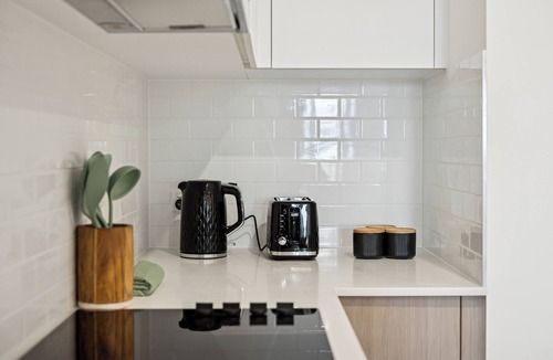 Cannington Apartment | Cannington Comfort – Beside Carousel & Curtin, featuring modern design and rooftop amenities.