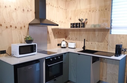 Croydon Park Apartment | Cozy studio with trendy design, fully equipped kitchen, & modern bathroom.