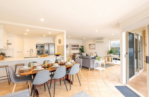 Corlette House | Danalene, 44a Danalene Pde - stunning waterfront property with Air Con, WI-FI, Garage & Boat Parking