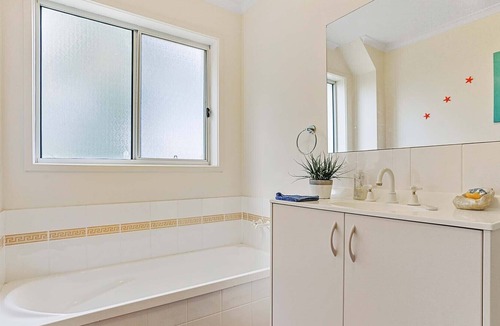 Tura Beach House | Easy golf course access with a lovely ocean views