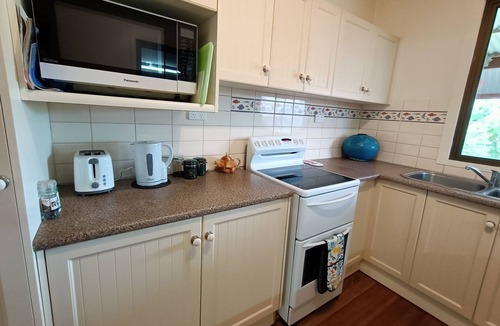 Kurrimine Beach Cottage | Gumnuts, A Coastal Bungalow, listen to the waves in Kurrimine Beach