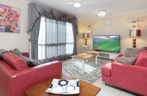 Mount Louisa House | Lovely 3BR home surrounded by lush greenery. Perfect escape for tranquility.