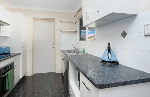 Mount Louisa House | Lovely 3BR home surrounded by lush greenery. Perfect escape for tranquility.