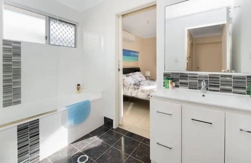 Mount Louisa House | Lovely 3BR home surrounded by lush greenery. Perfect escape for tranquility.
