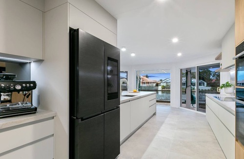 Pelican Waters House | Luxury Waterfront Resort Style Pool, Spa & Firepit