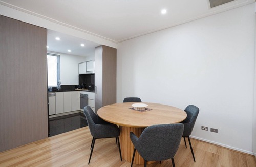 City East Apartment | Modern 1-Bed Unit with Pool Views and Balcony