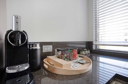 City East Apartment | Modern 1-Bed Unit with Pool Views and Balcony