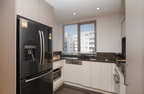 City East Apartment | Modern 1-Bed Unit with Pool Views and Balcony