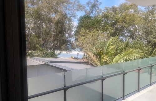 Bongaree Apartment | Near new, absolute beachfront apartment with views of Redcliff and Brisbane.
