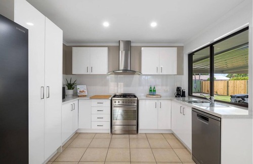 Wurtulla House | Palm Coastal Retreat - Family & Pet-Friendly, Spacious Yard, 5 Mins to Beach!