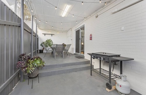 Kooringal Apartment | Patio with BBQ | Festoon Lights | Full Kitchen