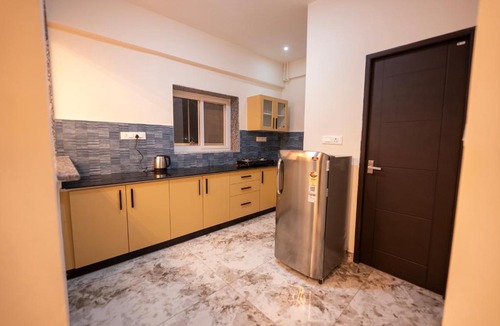 Devanahalli Apartment | Runway Retreat Rooftop Swing, Airport View