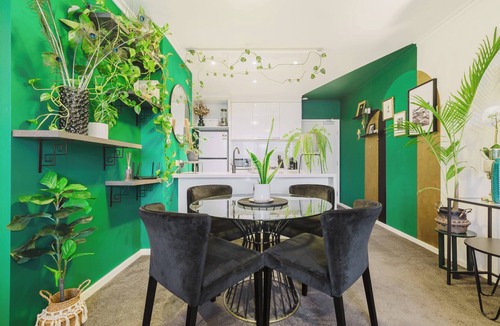 Southbank Condo | Serene botanical oasis with city views and sunroom