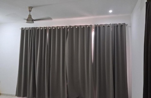 Sanwer Apartment | Spacious bedroom with a patio attached