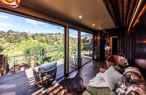 Hepburn Cottage | Teetering over a ravine, with a petrified stone bath older than the dinosaurs