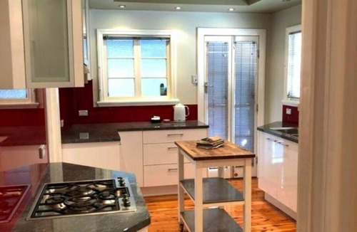 Wavell Heights House | The Heights! Comfortable, cosy Queenslander cottage with a retro vibe.