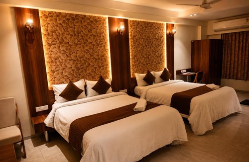 GIDC Hotel | The Palm Regency Beacon Vapi