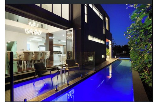 Broadbeach Waters House | This Waterfront has spa and two swimming pools in an architectural design.