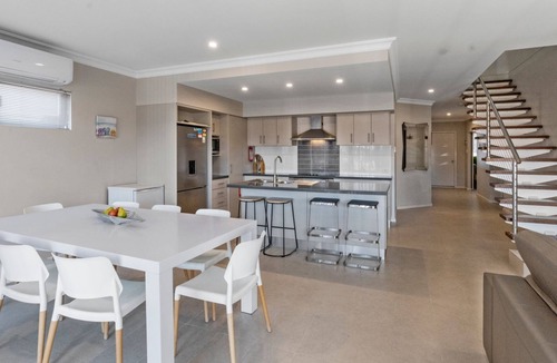 Exmouth House | Wave - Modern Villa on the Exmouth Marina with boat mooring.