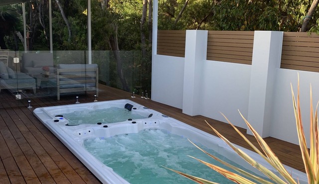 A nature haven within walking distance to beach/town with pool - swim spa- deck.
