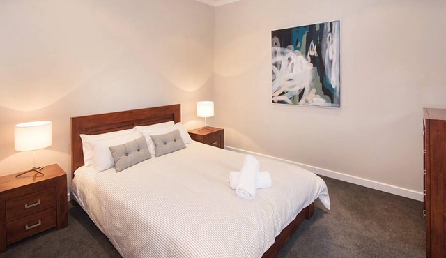 A stylish and modern home, situated in manicured gardens.
