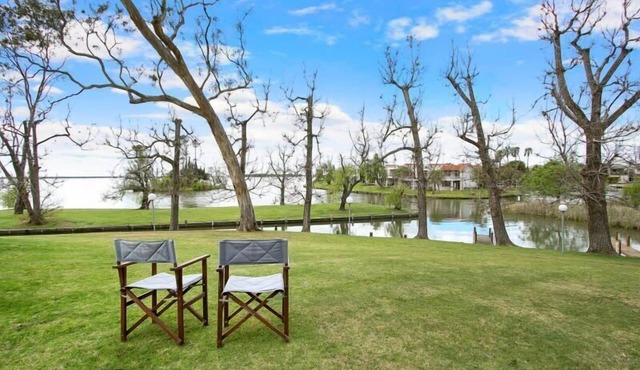 Beautiful waterfront townhouse on Lake Mulwala with a tropical feel.
