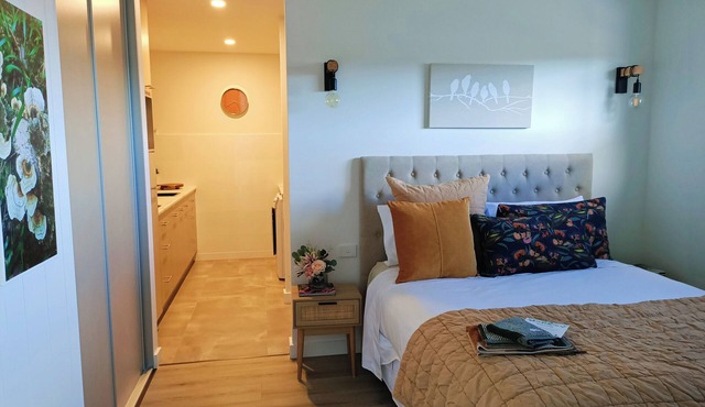 Cosy 1 Bedroom Unit with separate living space, laundry and kitchen.