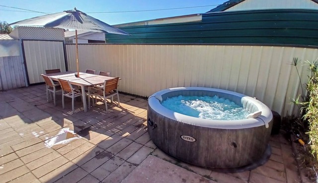 Cozy industrial home with hot tub & fruit garden