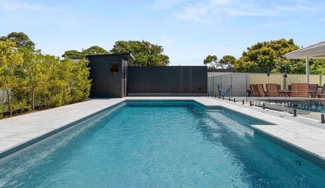 Luxe 4BR Retreat with Heated Pool & Finnish Sauna, Steps to the Beach