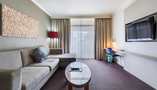 Resort Style Getaway with King Bed Pool and Balcony
