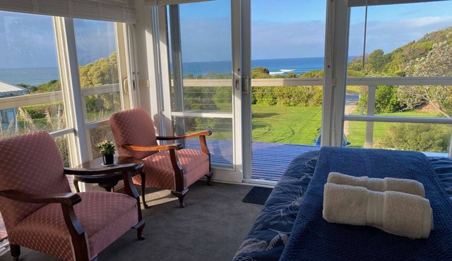 Self-Contained Double Storey Beach House Across the Road from the Beach with Incredible Ocean Views.