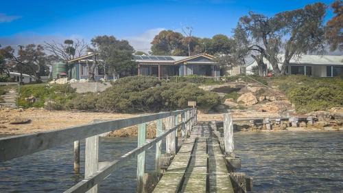 Sunset Ridge Has Direct Access To A Private Beach and Small Jetty
