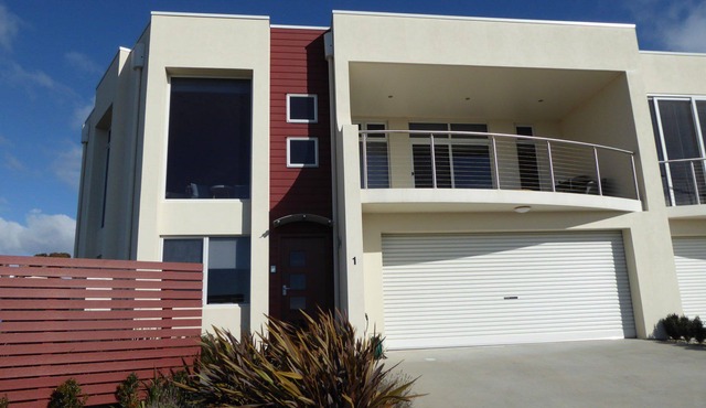 This stunning, split level town house is in the box seat at Bridport with...
