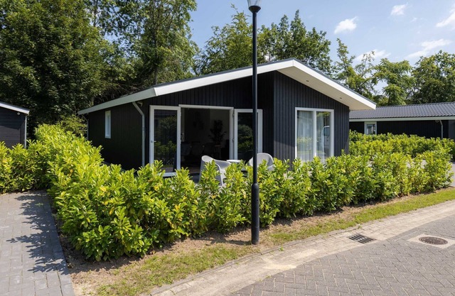 Nice chalet on the edge of the forest in a holiday park in the Brabant Kempen in Veldhoven
